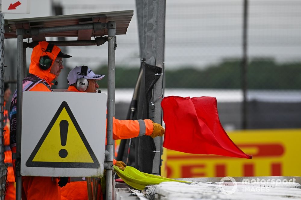 Marshals wave the red flag