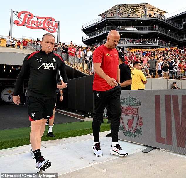 Slot’s newly-hired assistants Johnny Heitinga and Sipke Hulshoff (left) were both animated