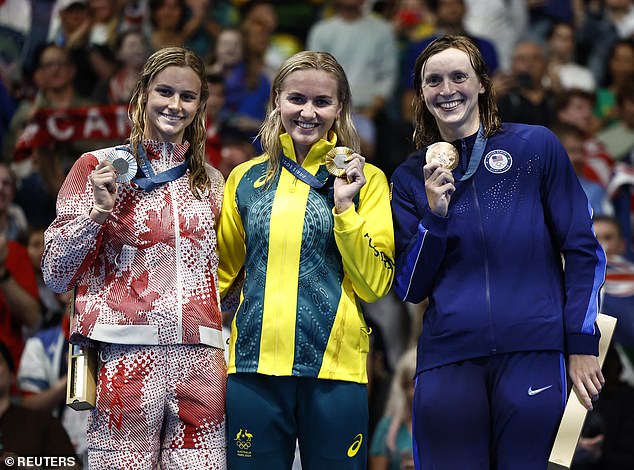 The relay team's win came just after Ariarne Titmus (centre) won gold in the 400m freestyle over Summer McIntosh (left) and her great rival Katie Ledecky (right)