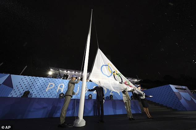 At the rain-soaked opening ceremony, the Olympic flag was inexplicably raised upside down