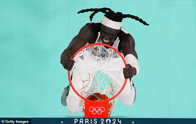 Wenyen Gabriel dunks the ball during the match