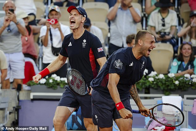 Andy Murray and Dan Evans (right) celebrated a remarkable victory over Kei Nishikori and Taro Daniel
