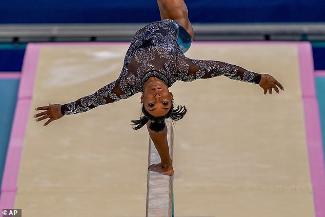 Biles earned a 15.300 score between her two vaults, and also finished the Sunday atop the overall leaderboard with a score of 59.566