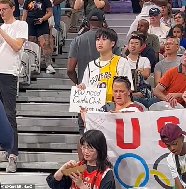 The fan held up a sign that read 'you need Caitlin Clark to beat us' before their game with Japan
