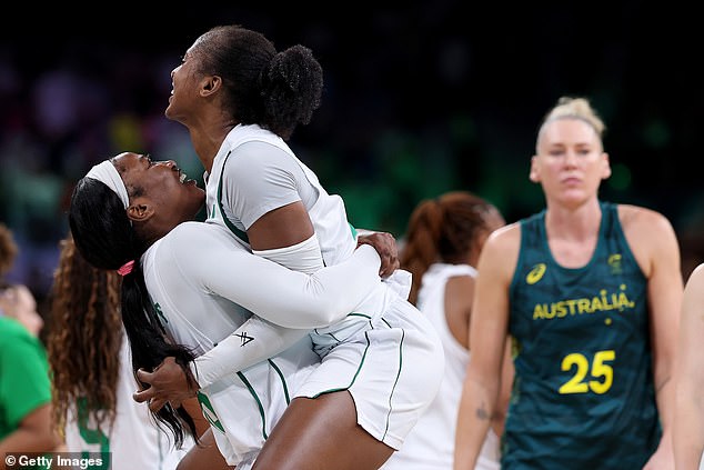 Elizabeth Balogun and Adebola Adeyeye of Team Nigeria celebrate their victory against the Opals during their Olympic opening.
