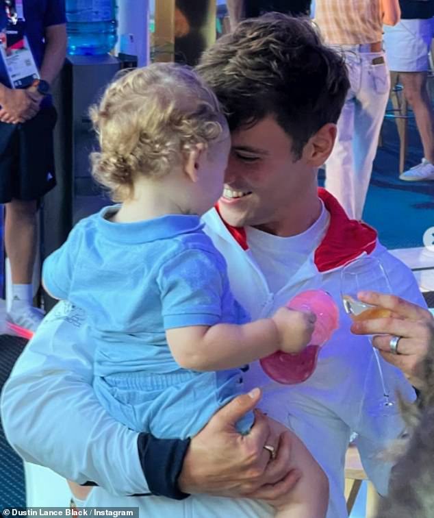 Tom Daley's husband Dustin Lance Black, 50, took to Instagram with a slew of sweet family snaps as they celebrated the diver's Olympic win in Paris on Monday