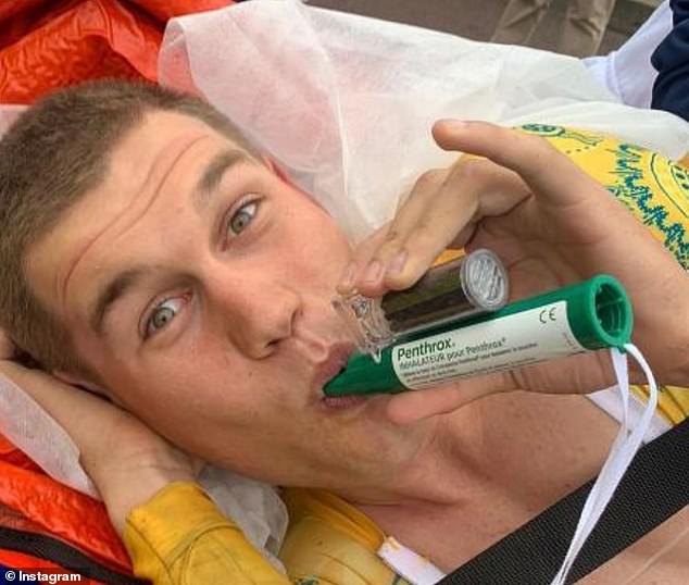 The 23-year-old was racing in testing conditions in driving Paris rain before his fall (pictured, after his fall)