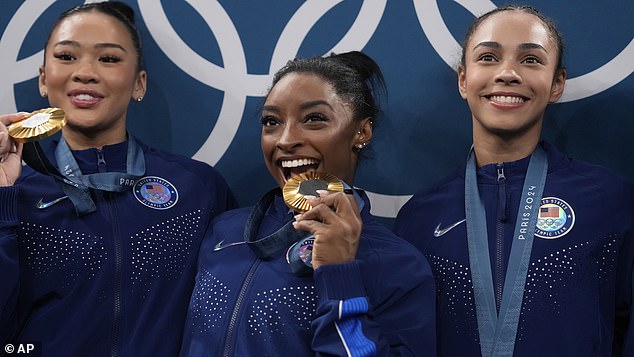 From left to right, Suni Lee, Simone Biles, Hezly Rivera celebrate after winning the gold medal