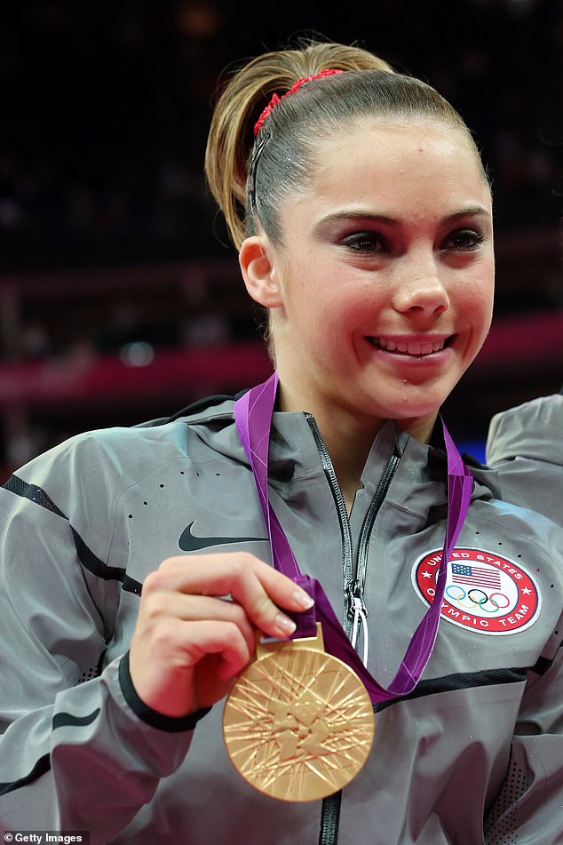 McKayla Maroney poses with the gold medal after Day 4 of the 2012 Games