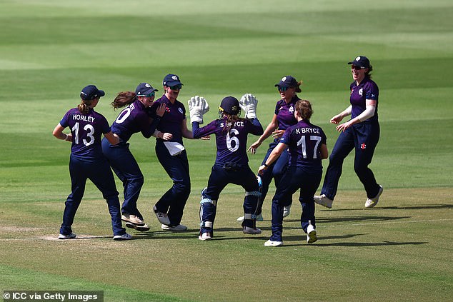 Scotland women players celebrate a wicket against Ireland during a T20 World Cup qualifier