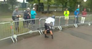 American cyclist Taylor Knibb falls off her bike FOUR times and her mechanic also takes a tumble as wet weather causes CHAOS in Paris Olympics time trials