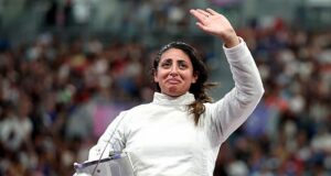 Egyptian fencer wins her opening match at the Olympic Games while SEVEN months pregnant