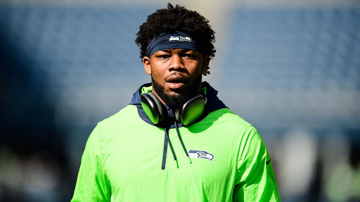 Rashaad Penny warms up