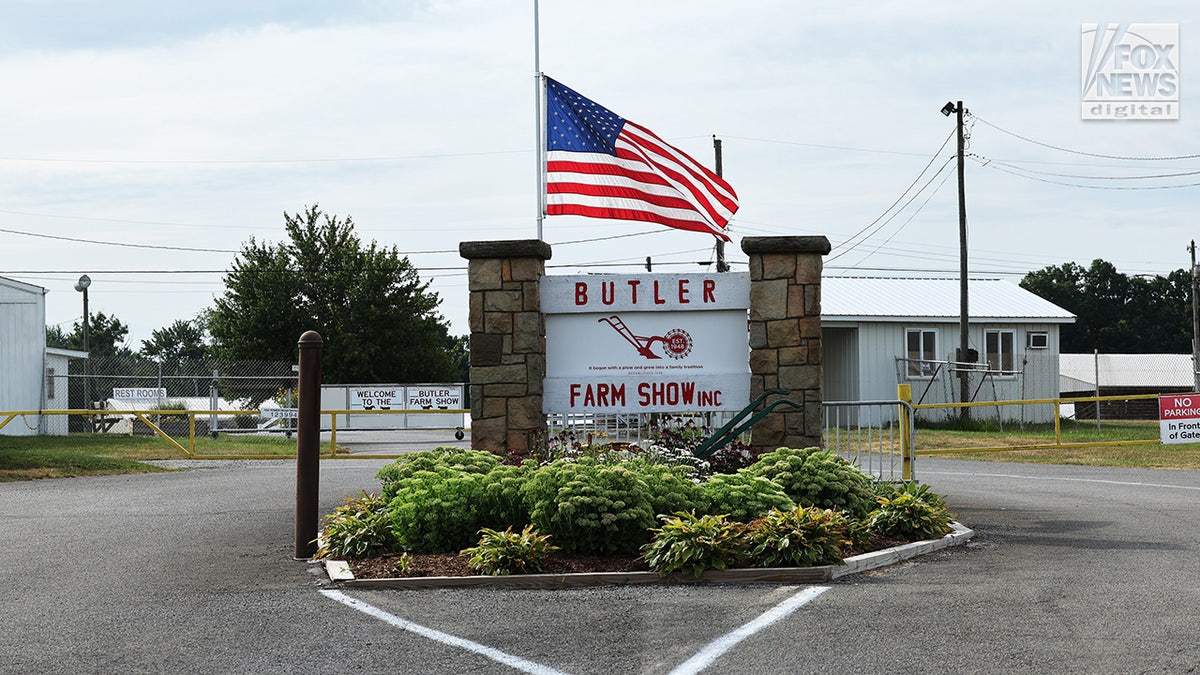 A flag lowered to half-mast at the Butler Farm Show entrance