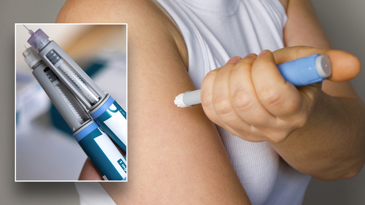 Close-up of Ozempic pens with a person injecting in the background