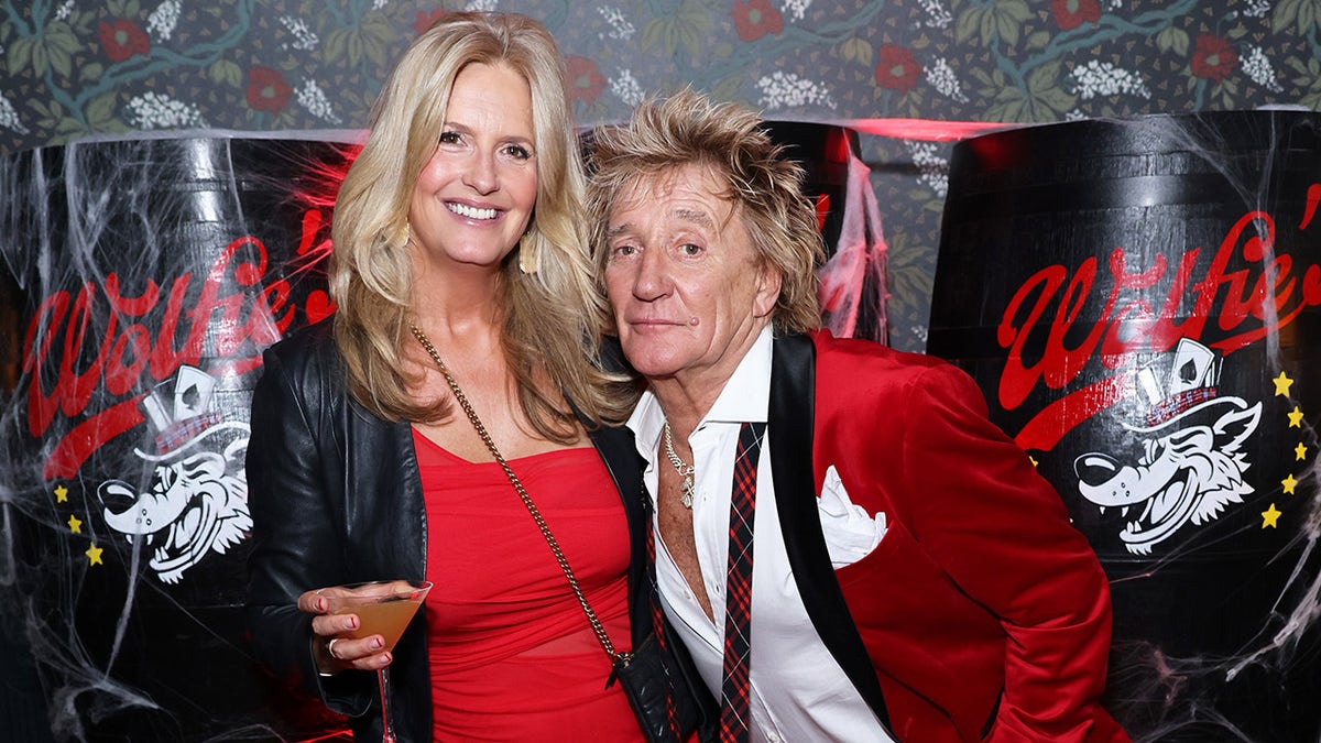 Penny Lancaster enjoying a martini with Rod Stewart
