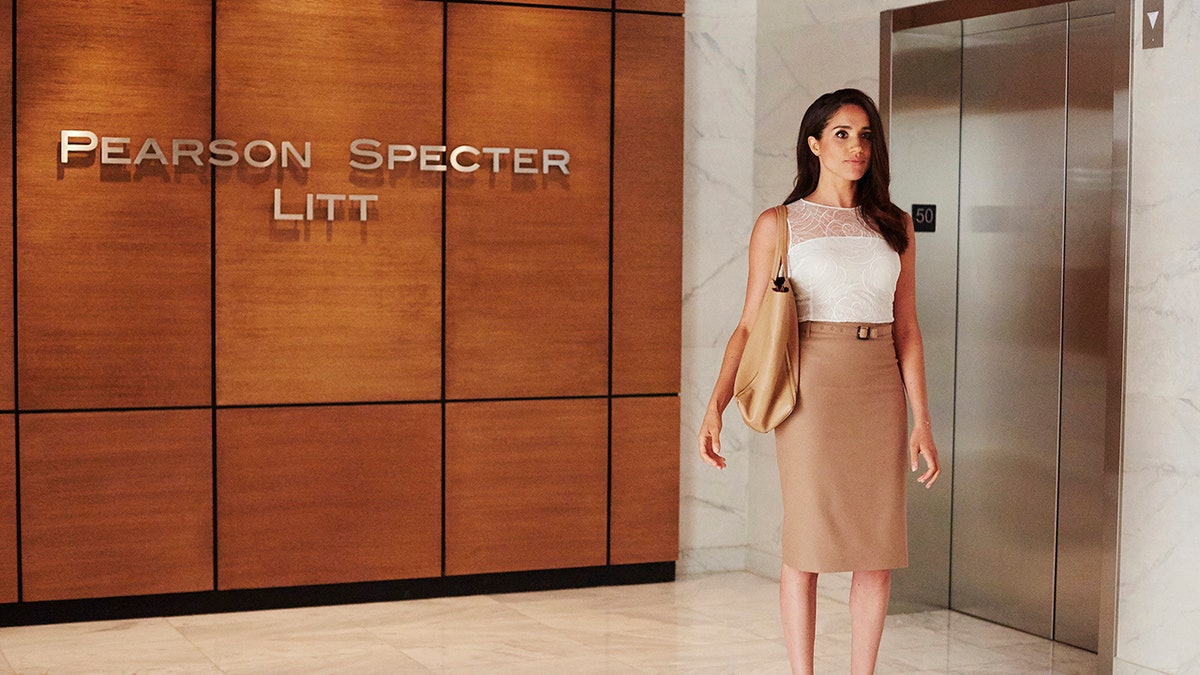 Meghan Markle wears long tan skirt and white blouse as Rachel in 'Suits'