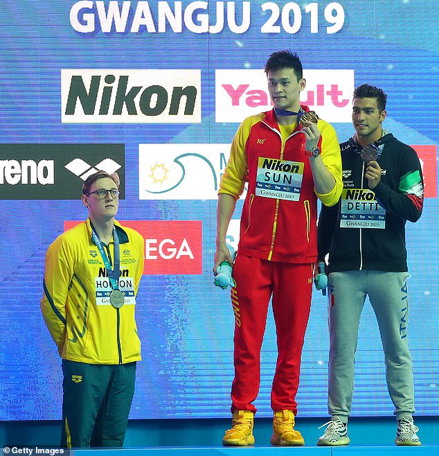 Mack Horton (left) refused to step on the podium after he was beaten by controversial Chinese star Sun Yang (centre) in 2019