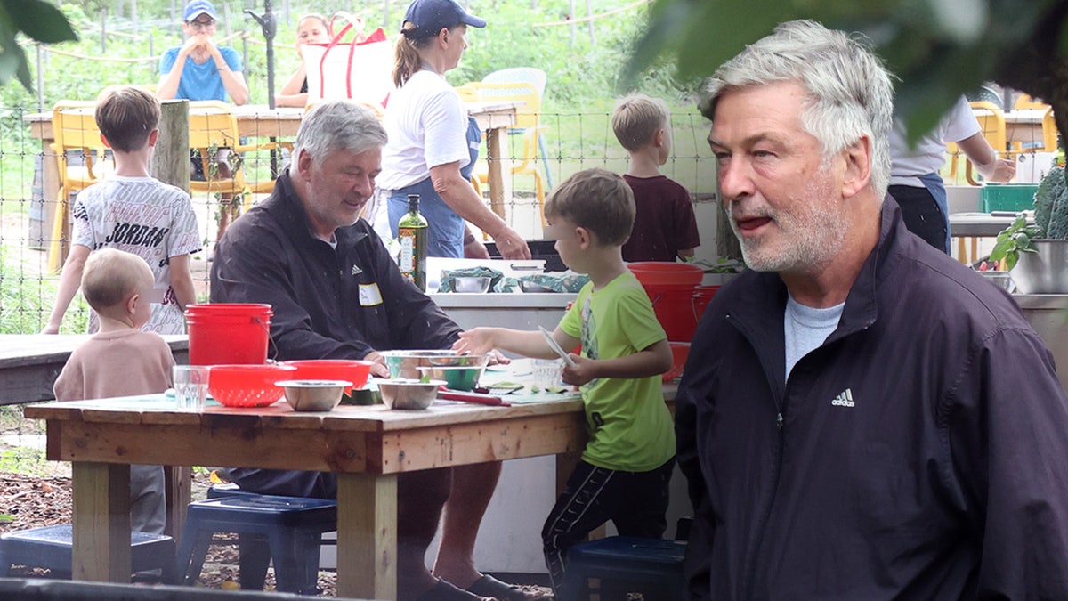 Alec Baldwin in Adidas coat filming TLC show with his kids.
