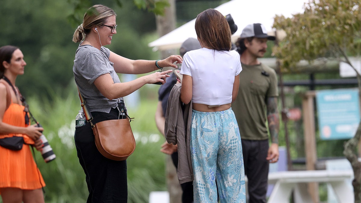 Hilaria Baldwin speaks with crew while filming.