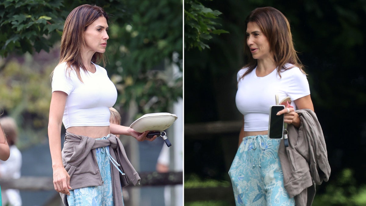 Hilaria Baldwin in white crop top and floral slacks.