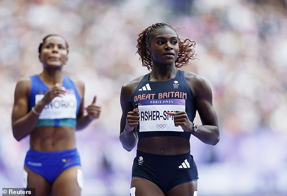 Paris 2024 Olympics - Athletics - Women's 100m Round 1 - Stade de France, Saint-Denis, France - August 02, 2024. Dina Asher-Smith of Britain reacts after finishing second place in heat 5. REUTERS/Alina Smutko