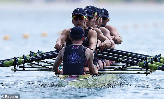 Paris 2024 Olympics - Rowing - Women's Eight Heats - Vaires-sur-Marne Nautical Stadium - Flatwater, Vaires-sur-Marne, France - July 29, 2024. Heidi Long of Britain, Rowan McKellar of Britain, Holly Dunford of Britain, Emily Ford of Britain, Lauren Irwin of Britain, Eve Stewart of Britain, Harriet Taylor of Britain, Annie Campbell-Orde of Britain and Henry Fieldman of Britain in action. REUTERS/Molly Darlington
