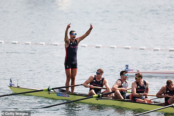 PARIS, FRANCE - AUGUST 03: Sholto Carnegie celebrates alongside teammates after Team Great Britain clinches gold in the Men's Eight Finals on day eight of the Olympic Games Paris 2024 at Vaires-Sur-Marne Nautical Stadium on August 03, 2024 in Paris, France. (Photo by Alex Davidson/Getty Images)