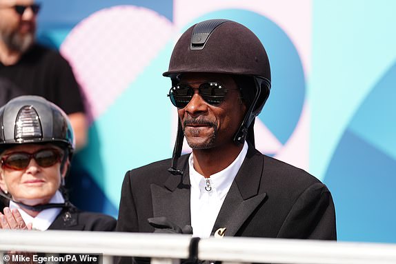 Snoop Dogg enjoying the Dressage Team Grand Prix Special at the Chateau de Versailles on the eighth day of the 2024 Paris Olympic Games in France. Picture date: Saturday August 3, 2024. PA Photo. Photo credit should read: Mike Egerton/PA Wire.RESTRICTIONS: Use subject to restrictions. Editorial use only, no commercial use without prior consent from rights holder.