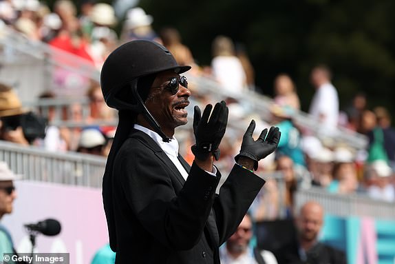 VERSAILLES, FRANCE - AUGUST 03: Snoop Dogg attends the Dressage Team Grand Prix Special on day eight of the Olympic Games Paris 2024 at Chateau de Versailles on August 03, 2024 in Versailles, France. (Photo by Mike Hewitt/Getty Images)