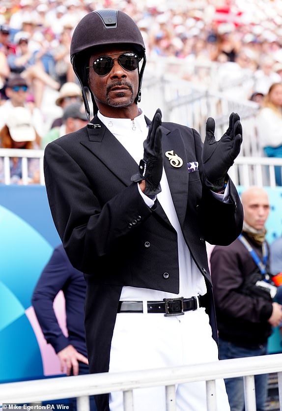 Snoop Dogg watching the Dressage Team Grand Prix Special at the Chateau de Versailles on the eighth day of the 2024 Paris Olympic Games in France. Picture date: Saturday August 3, 2024. PA Photo. Photo credit should read: Mike Egerton/PA Wire.RESTRICTIONS: Use subject to restrictions. Editorial use only, no commercial use without prior consent from rights holder.