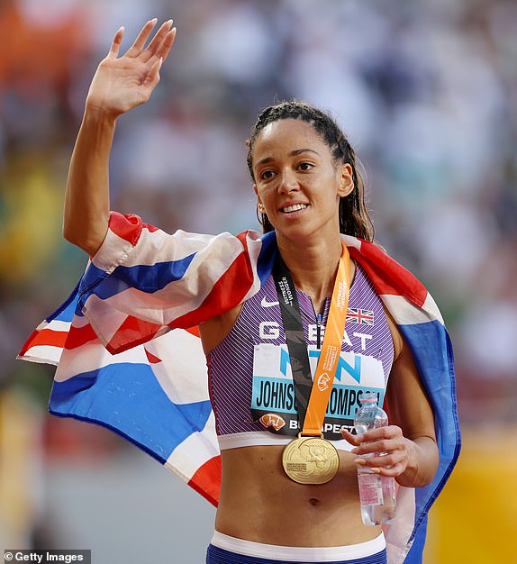BUDAPEST, HUNGARY - AUGUST 20: Katarina Johnson-Thompson celebrates after winning the gold medal in the Women's 800m Heptathlon final during day two of the World Athletics Championships Budapest 2023.