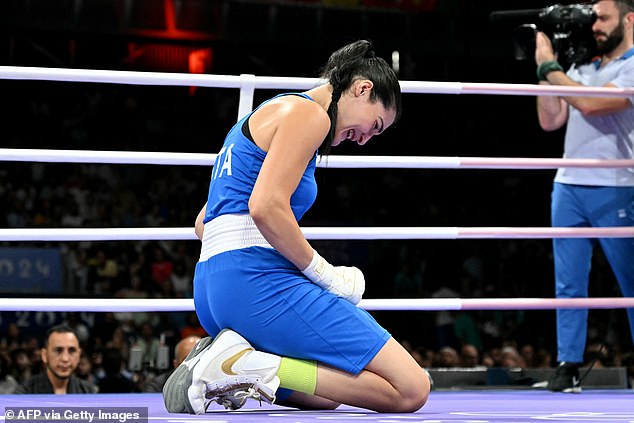 The Italian boxer dropped to her knees after abandoning and was seen crying in the ring