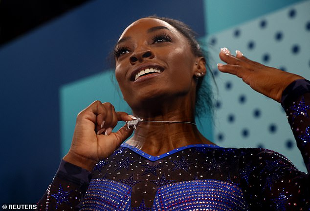 Simone Biles showing off her new bling after her historic win at the Paris Olympics