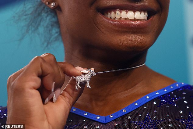 She revealed her goat necklace after winning gold in the gymnastics all-around event