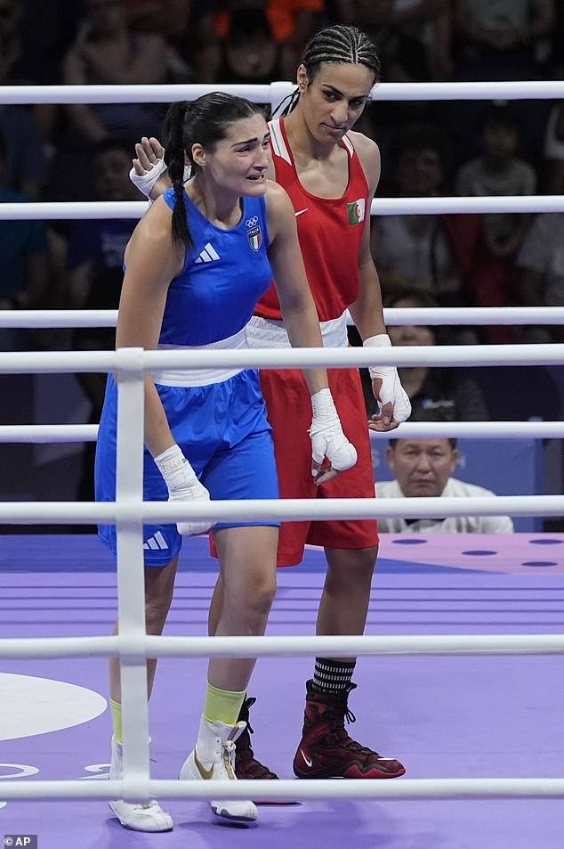 Raising a fist in victory as an utterly crushed Carini looks down, shoulders slumped, before condescendingly patting her on the back.