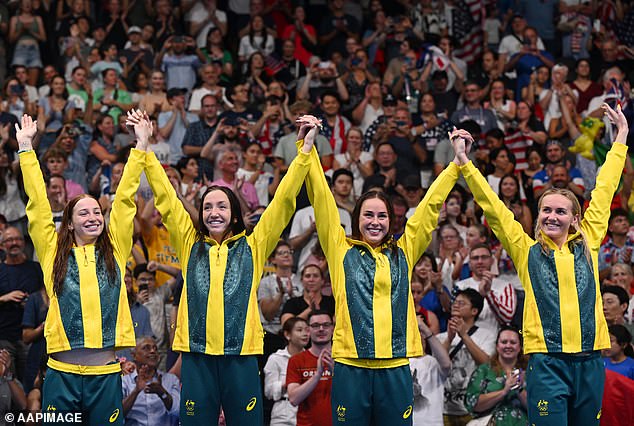 Pictured left to right: Mollie O'Callaghan, Lani Pallister, Brianna Throssell and Ariarne Titmus salute the crowd as they take to the podium to receive their medals