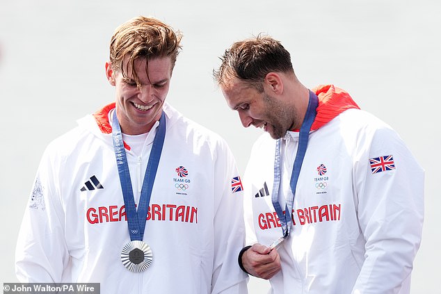 Ollie Wynne-Griffith and Tom George receive their silver medals during the Rowing Men's Pair finals ceremony.