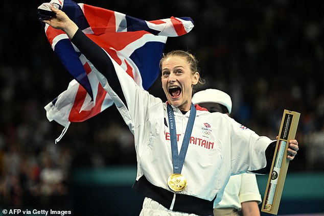 Bryony Page celebrating at the end of her routine, showcasing the highest difficulty level in the competition.