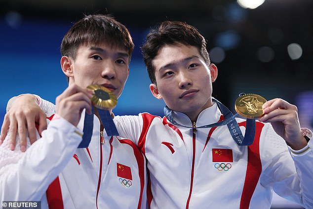 Daoyi Long and Zongyuan Wang of China after winning gold in the Men's Synchronised 3 metre Springboard event