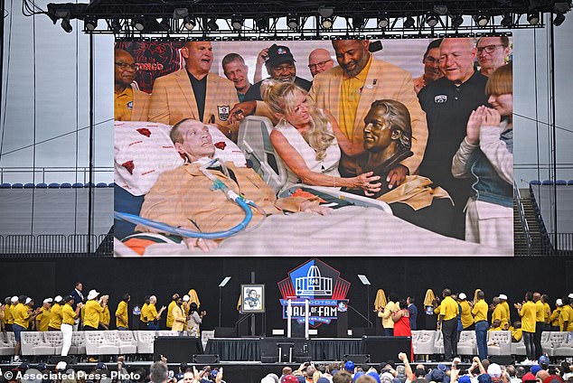 McMichael's induction occurred in his Illinois home, surrounded by his wife and teammates