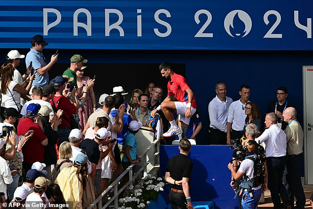Shortly after the match, Djokovic climbed into the crowd and made a beeline for his family