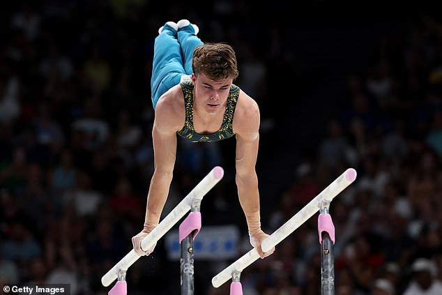 South Australian gymnast Jesse Moore competes on the parallel bars in Paris, showcasing an Aussie flair in his routine preparation