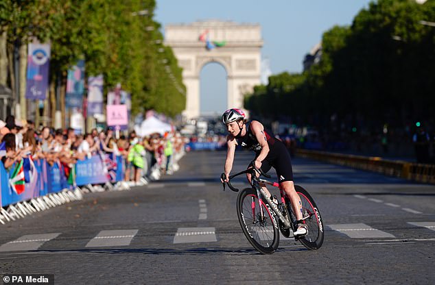Great Britain´s Georgia Taylor-Brown rides in front of the Arc de Triomphe
