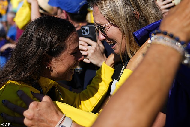 Fox celebrates with her supporters after earning the prestigious gold medal in Paris