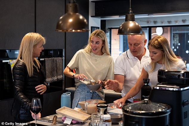 Keely Hodgkinson alongside sister Jessica Hodgkinson (r), mother Rachel Hodgkinson and father Dean Hodgkinson during a family gathering on May 6, 2024 in Atherton, England