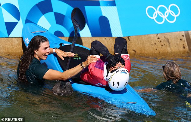 Jessica Fox is pictured after jumping into the water to celebrate with her sister after the stunning victory on Tuesday