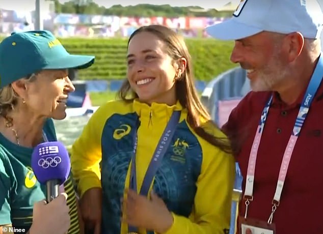 Proud parents Myriam Fox-Jerusalmi and Richard Fox are pictured celebrating with Noemie after her stunning kayak cross win on Tuesday morning