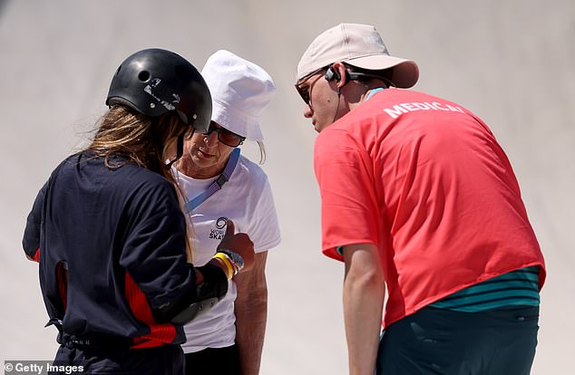 The medical team speaks to Brown about her shoulder following her heavy fall