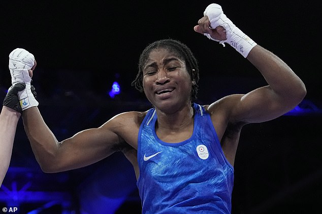 Cindy Ngamba crossed herself as she walked out into an Olympic arena where she fought a French opponent, Davina Michel. Boos rained down on Ngamba (pictured above)
